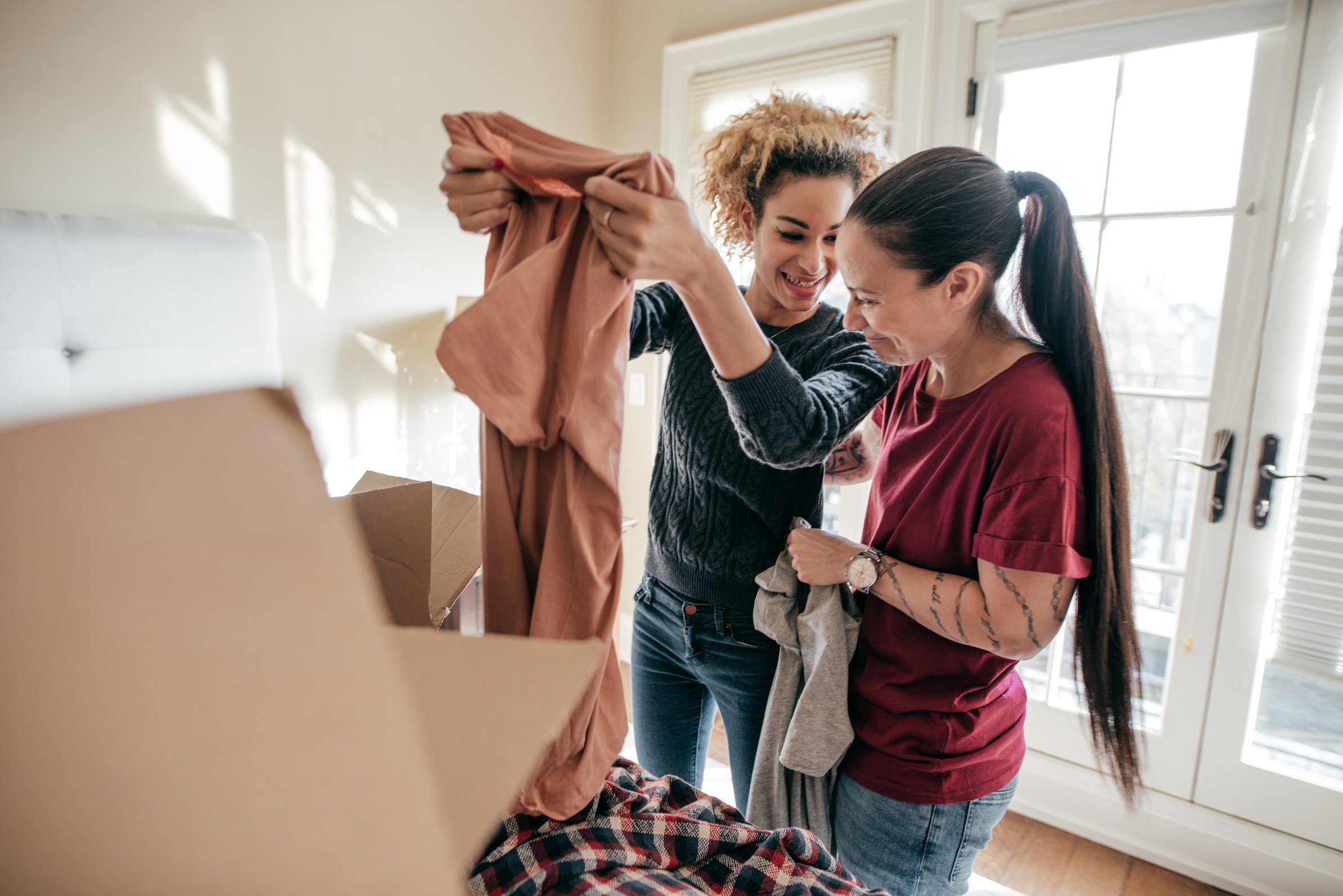 Lesbian Couple Unpacking in New Home